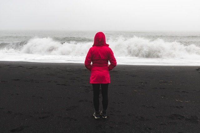 three line tales week94: little red riding hood, a girl in a red parka on a beach